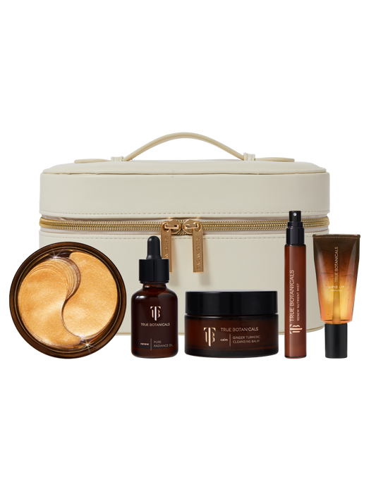 Skincare product set with a cream-colored travel case on a white background