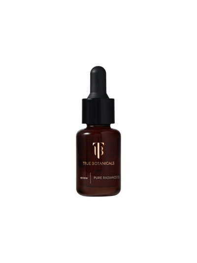 True Botanicals Renew Pure Radiance Oil travel size 15mL deep amber glass dropper bottle with a black rubber bulb top and gold logo, shown on a transparent background.